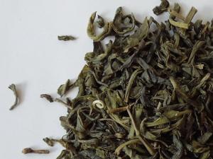 Loose-leaf green tea, with dark, slightly curled leaves