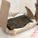 Picture of laohuangpian sheng (raw) pu-erh from ancient tea tree 2014 spring