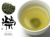 Cup of Green Tea, Green Tea Leaves, and a Japanese Character