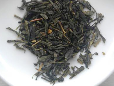 Loose-leaf green tea with fairly dark color, somewhat broken leaf