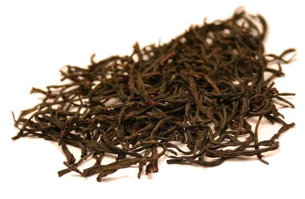 Loose-leaf black tea with long, wiry leaves, all fully intact
