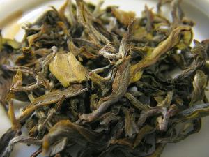 Loose leaf Darjeeling white tea showing a yellowish leaf color