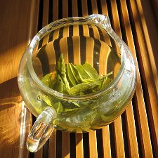 Lu an melon seed leaves steeping in a glass jug