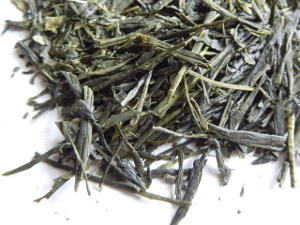 Loose leaf sencha, showing long, intact, dark green tea leaves