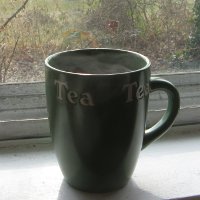 Mug of hot tea on a windowsill