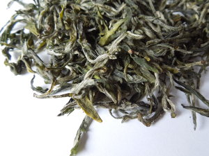 Loose-leaf green tea with pale green, downy leaves