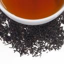Black tea leaves and a cup of black tea