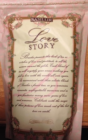 Pink packaging with Basilur logo at the top, Love Story written in script, and then a long paragraph of hard-to-read small script lettering underneath