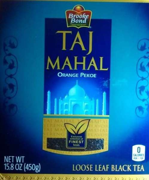 Front of Taj Majal Orange Pekoe loose leaf black tea box, blue background, red Brooke Bond logo at top