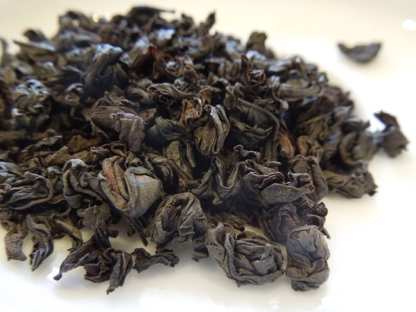 Tightly-rolled black tea leaves, looking like gunpowder tea or some oolongs