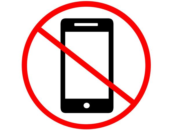 Abstract sign showing mobile phone with red slash and circle over it