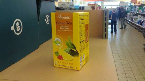 Box of Benner Green Tea, Lemon & Ginseng, on shelf in supermarket aisle